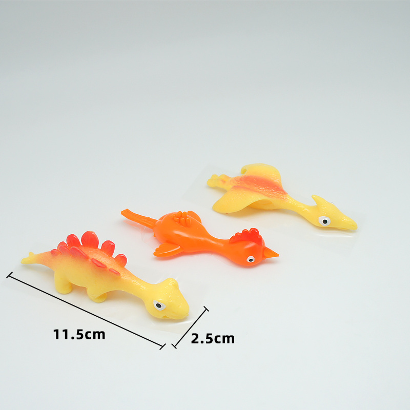 Hot Sale TPR Material High Quality Promotion TPR Dinosaur Toy Slingshot Catapult Toys Small Children Toys