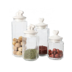 wholesale price different sizes glass candy jars with animal shape ceramic lid