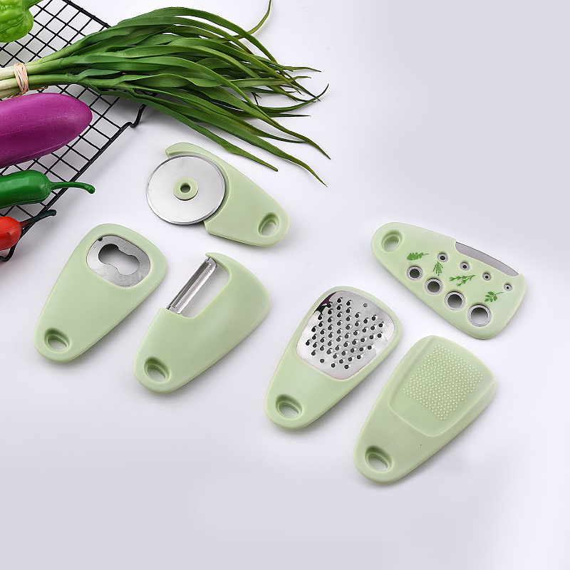 Factory wholesales stainless steel kitchen gadgets with plastic handle peeler grater can opener pizza cutter slicer garlic press