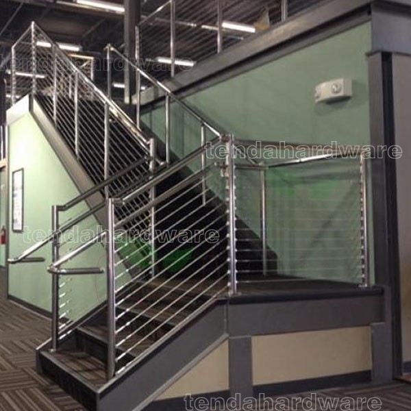 Stainless steel railings with braided aircraft cables and Milled walnut handrails