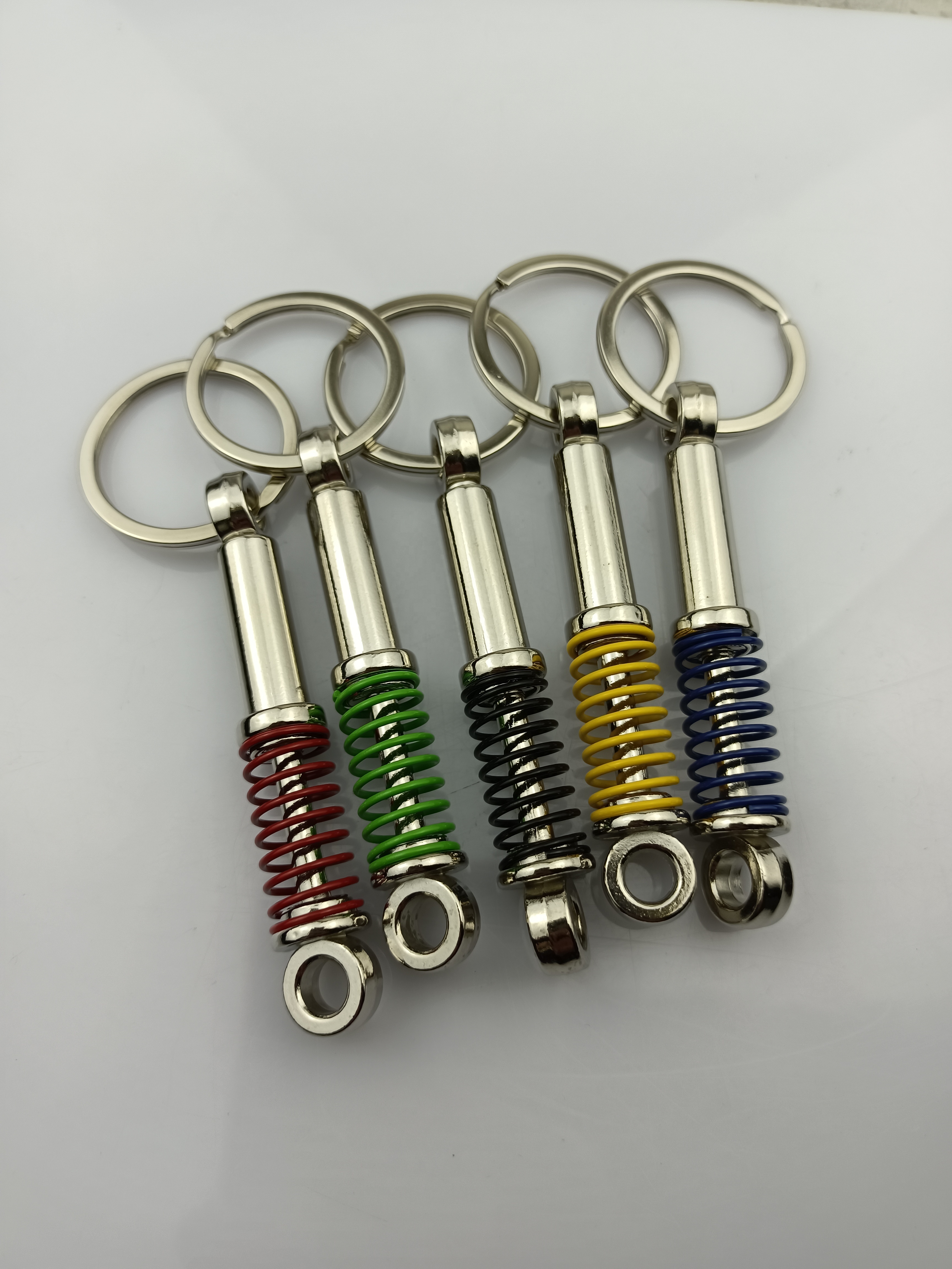 Wholesale custom Metal car Shock absorber shape keychain Auto car parts keychain