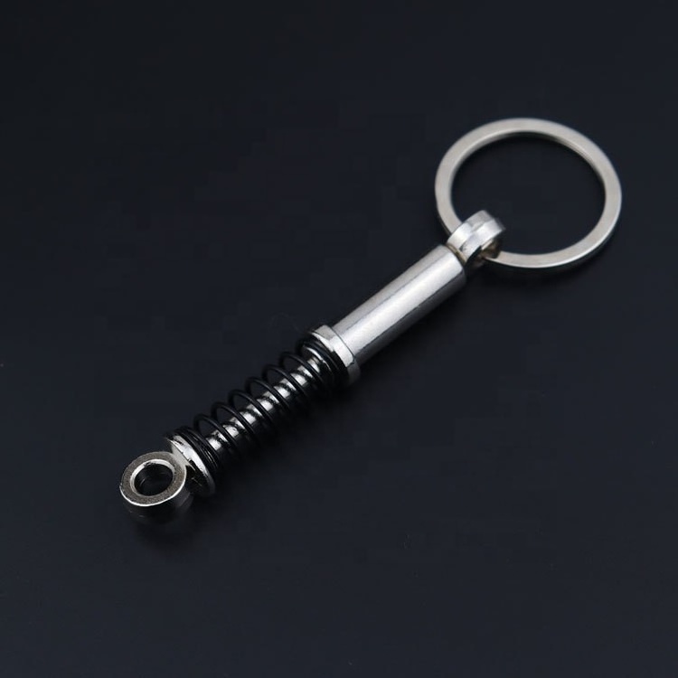 Wholesale custom Metal car Shock absorber shape keychain Auto car parts keychain