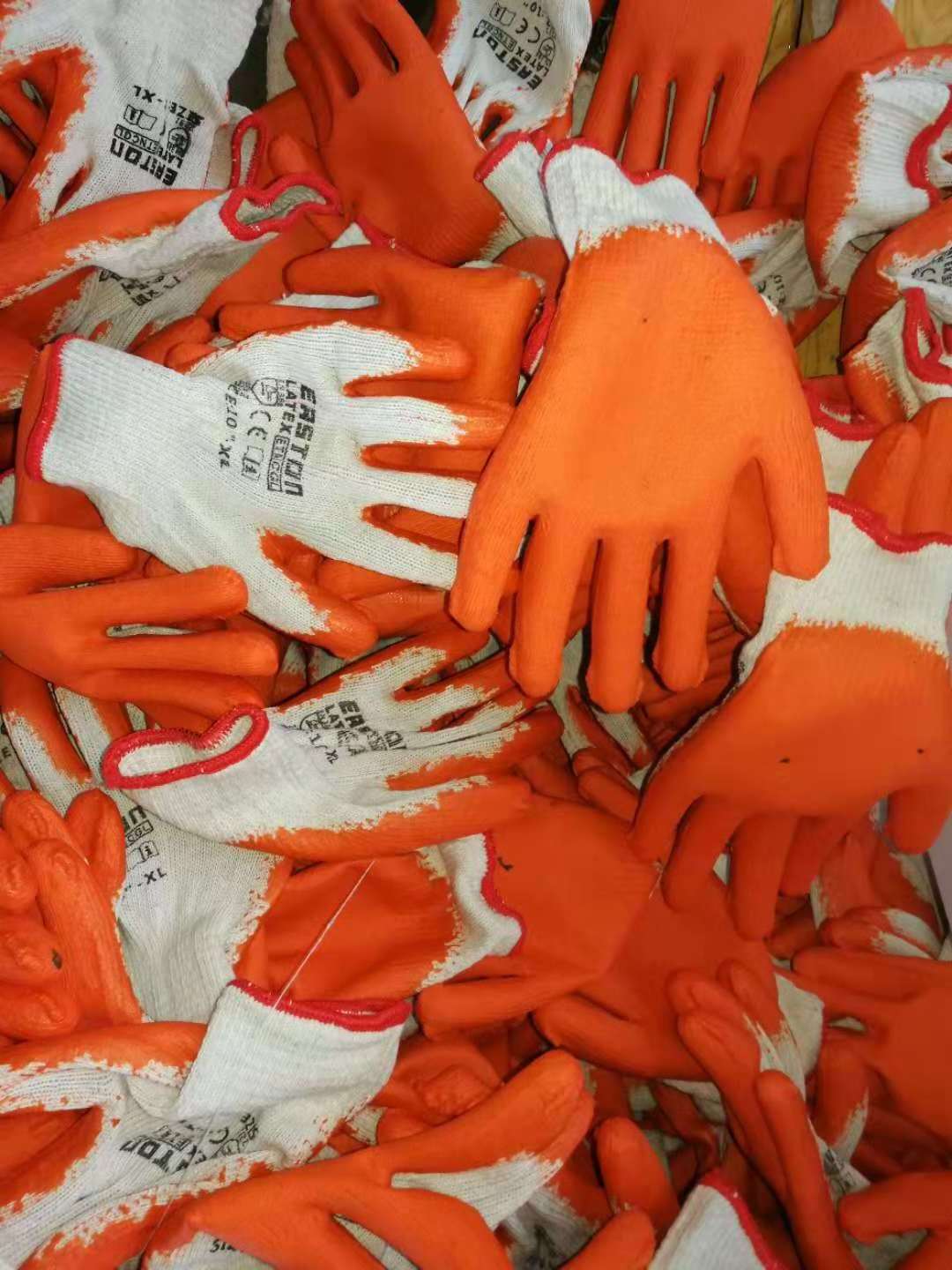 National hot selling safety gloves glue material does not hurt hands latex gloves orange latex gloves suitable for workers