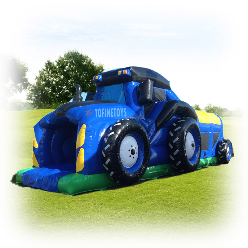 Giant inflatable tractor bouncer castle with obstacle course and slide