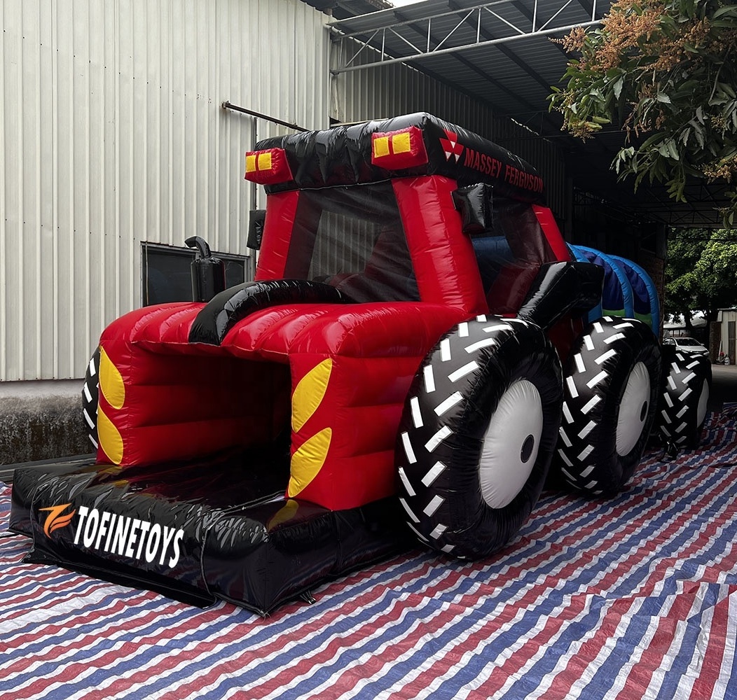 Giant inflatable tractor bouncer castle with obstacle course and slide