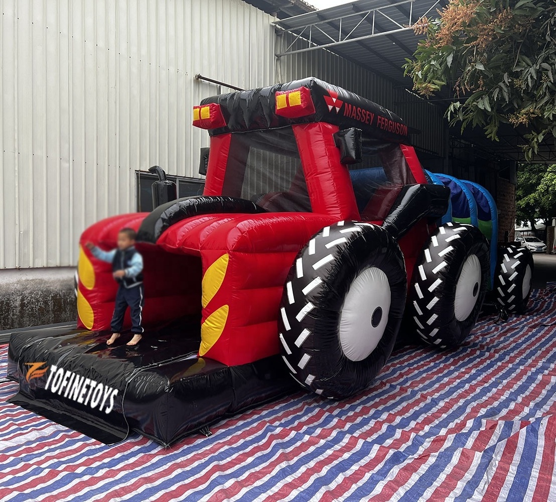 Giant inflatable tractor bouncer castle with obstacle course and slide