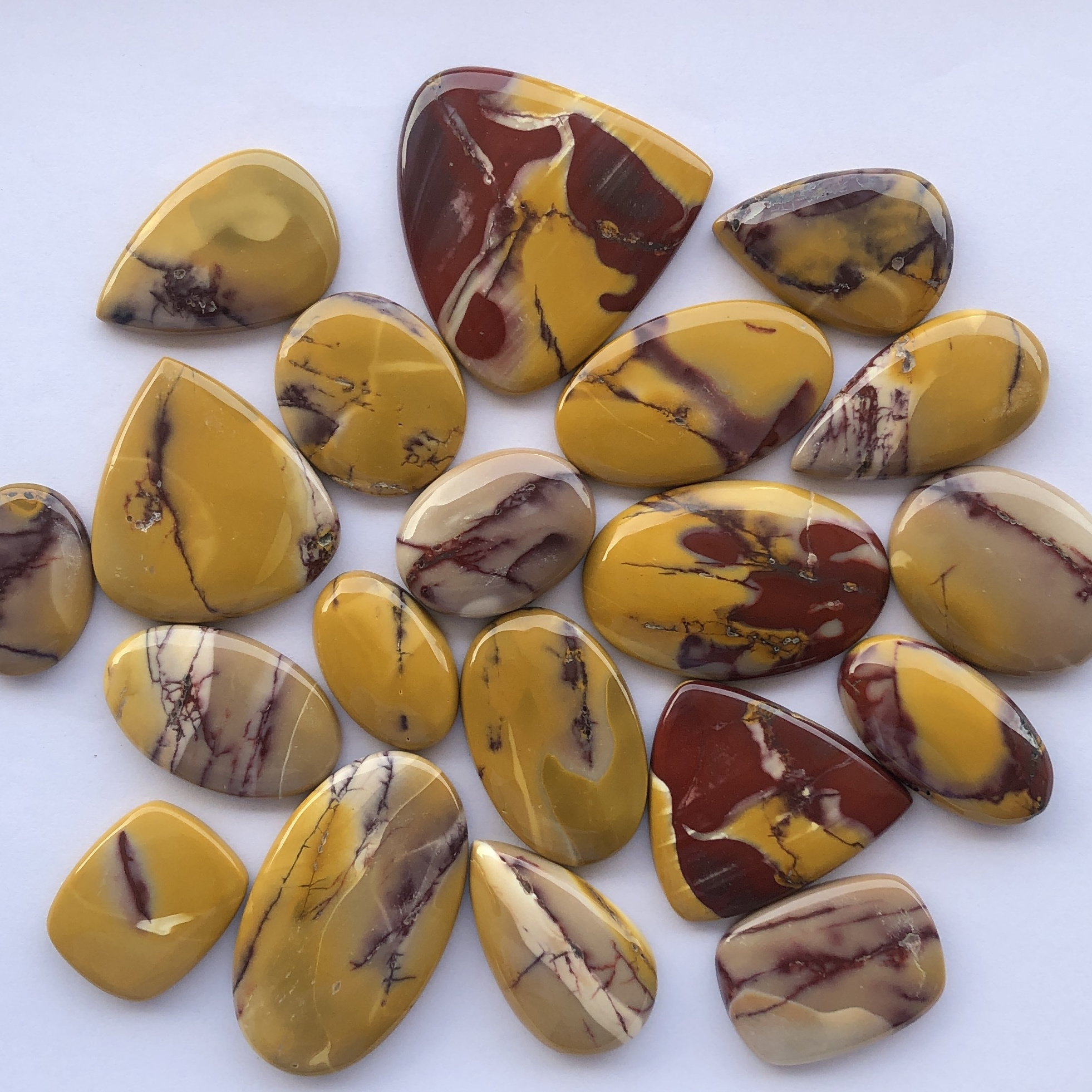 Natural Yellow Red Mookaite Jasper Stones Smooth Loose Cabochon at Factory Price from Wholesale Gemstones Supplier Alibaba India