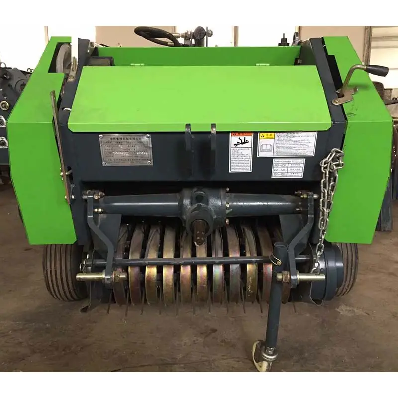 straw baler,The tractor is equipped with a round bale straw baler,pine straw baler for sale