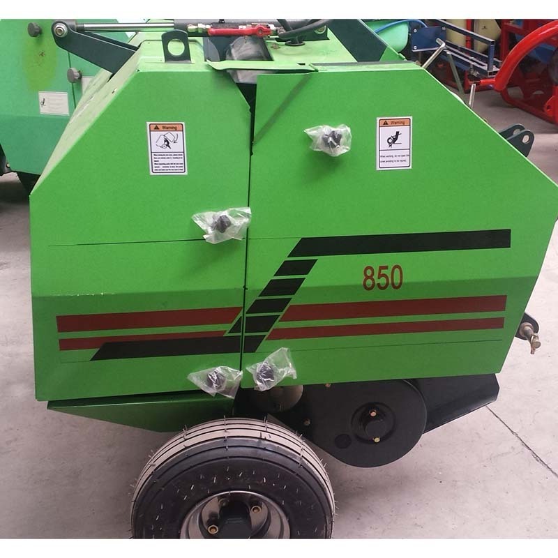 straw baler,The tractor is equipped with a round bale straw baler,pine straw baler for sale