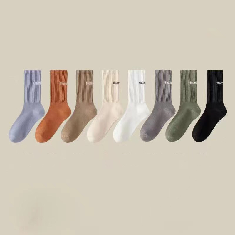 Autumn and winter women middle tube solid color sports couple socks ins trendy letter pile piles socks