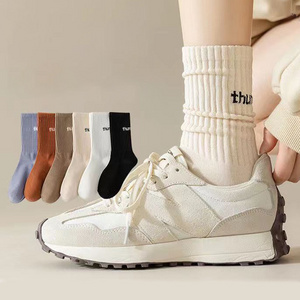 Autumn and winter women middle tube solid color sports couple socks ins trendy letter pile piles socks