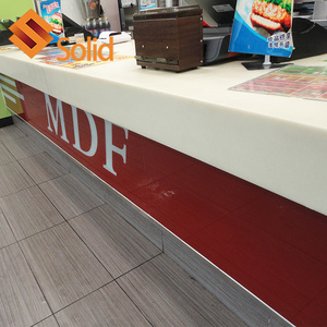 Burger fast food restaurant wood and artificial marble stone table order reception desk