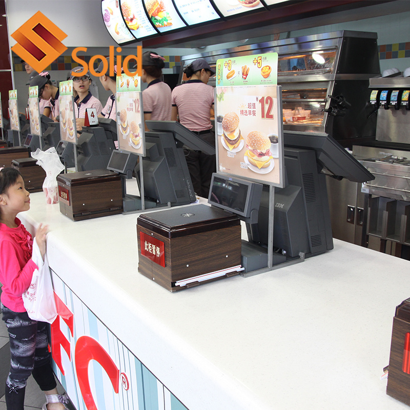 Burger fast food restaurant wood and artificial marble stone table order reception desk