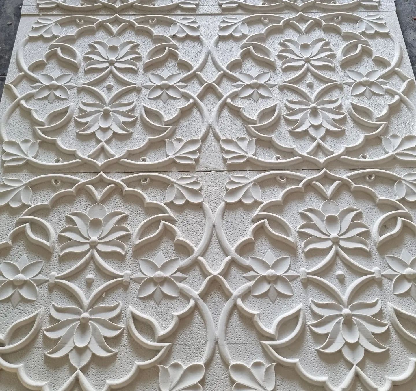 Carved marble wall panel