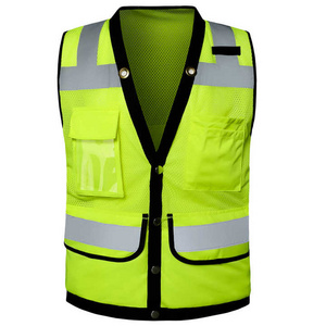 Fluorescent yellow, inexpensive, reflective West Hi Vis running safety worker vests with high visibility on the road