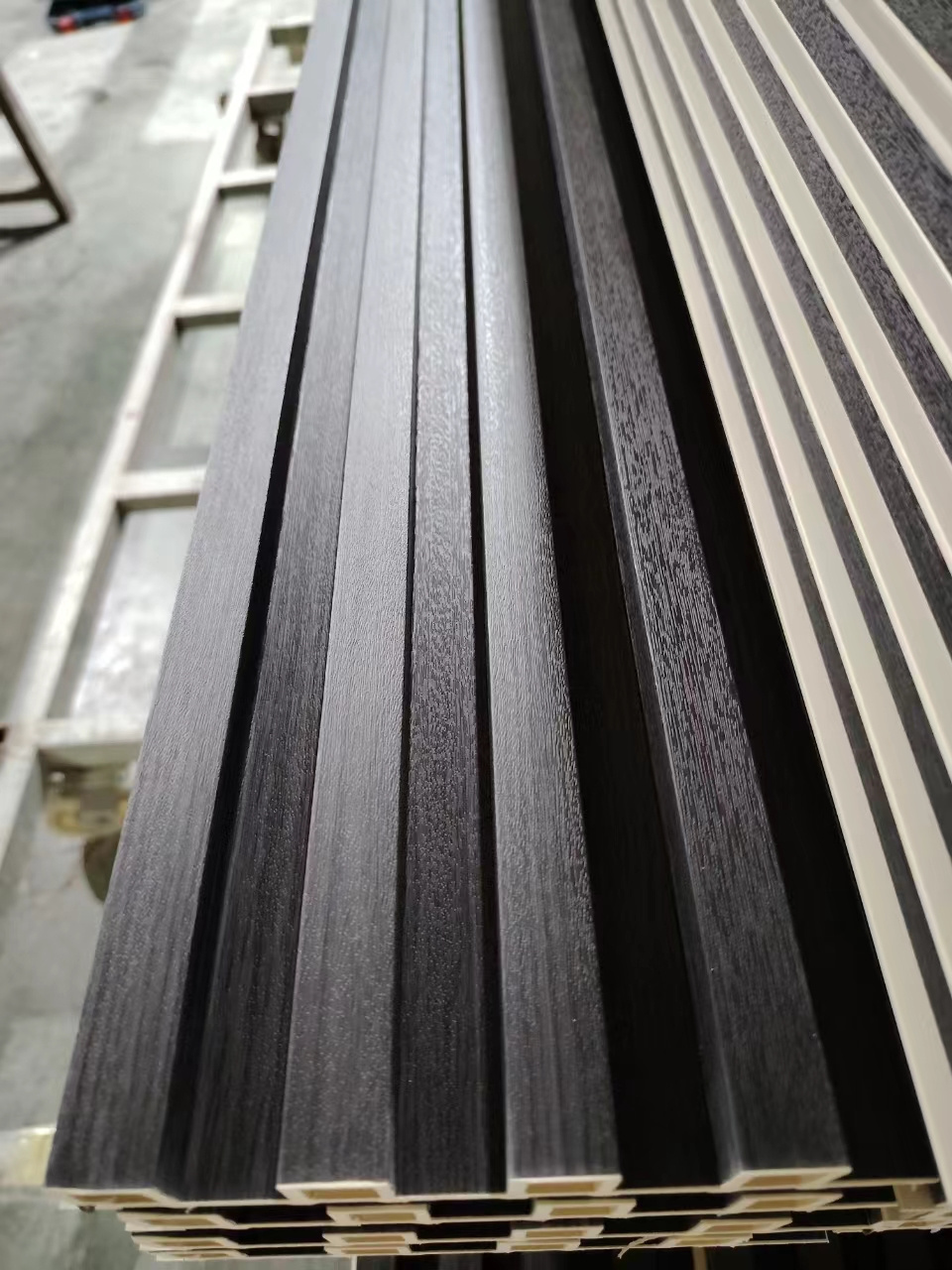 Wholesales Fluted Wooden Grain Black wood veneer WPC Wall Panel for Indoor Wall Decoration background walls