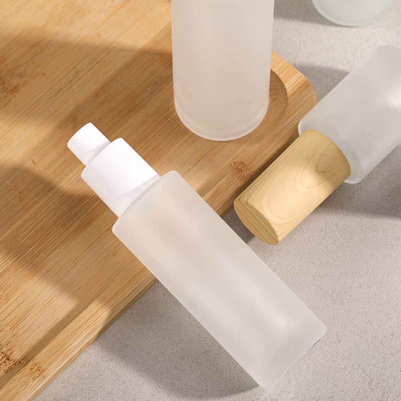 30ml 60ml 90ml 120ml bamboo cosmetic packaging customized frosted glass boston round lotion serum pump bottle with wooden lid