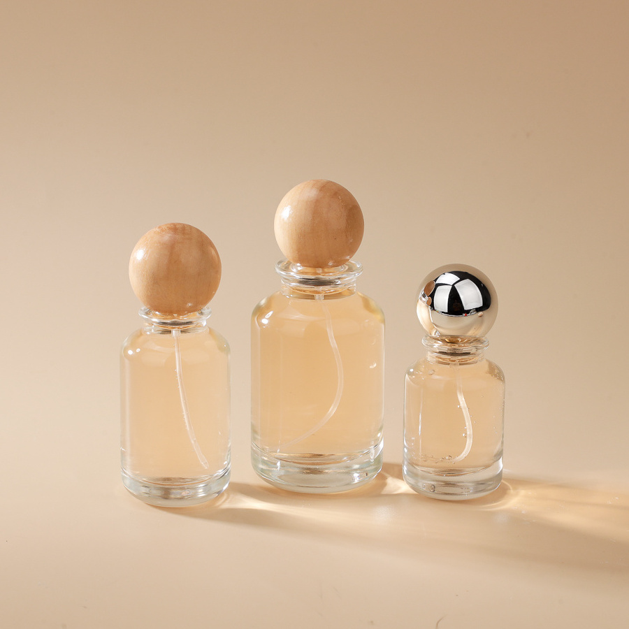 30ml 50ml 100ml Liquid Round Glass Perfume Spray Bottle Flacon De Parfum Glass Bottle with Walnut Ball Cap