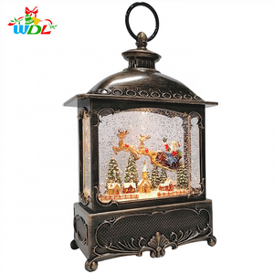 New Product 2023 Resin Home Decor Xmas Village Scene Flying Santa on Sleigh Led Christmas Lantern Light Snow Globe