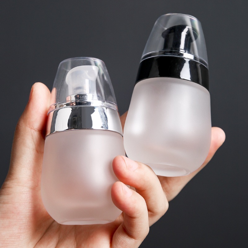 Luxury Oval Cosmetic Packaging 35ml Empty Pump Skincare Primer Liquid Lotion Foundation Glass Bottle 30ml Container Custom Logo