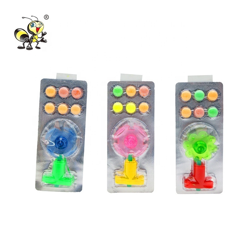 Kids cheap Spinning toy with pressed tablet candy wholesale