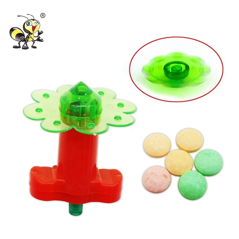 Kids cheap Spinning toy with pressed tablet candy wholesale