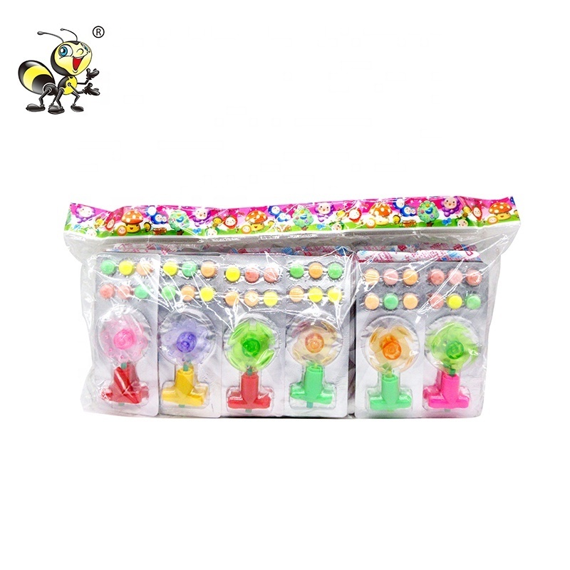 Kids cheap Spinning toy with pressed tablet candy wholesale