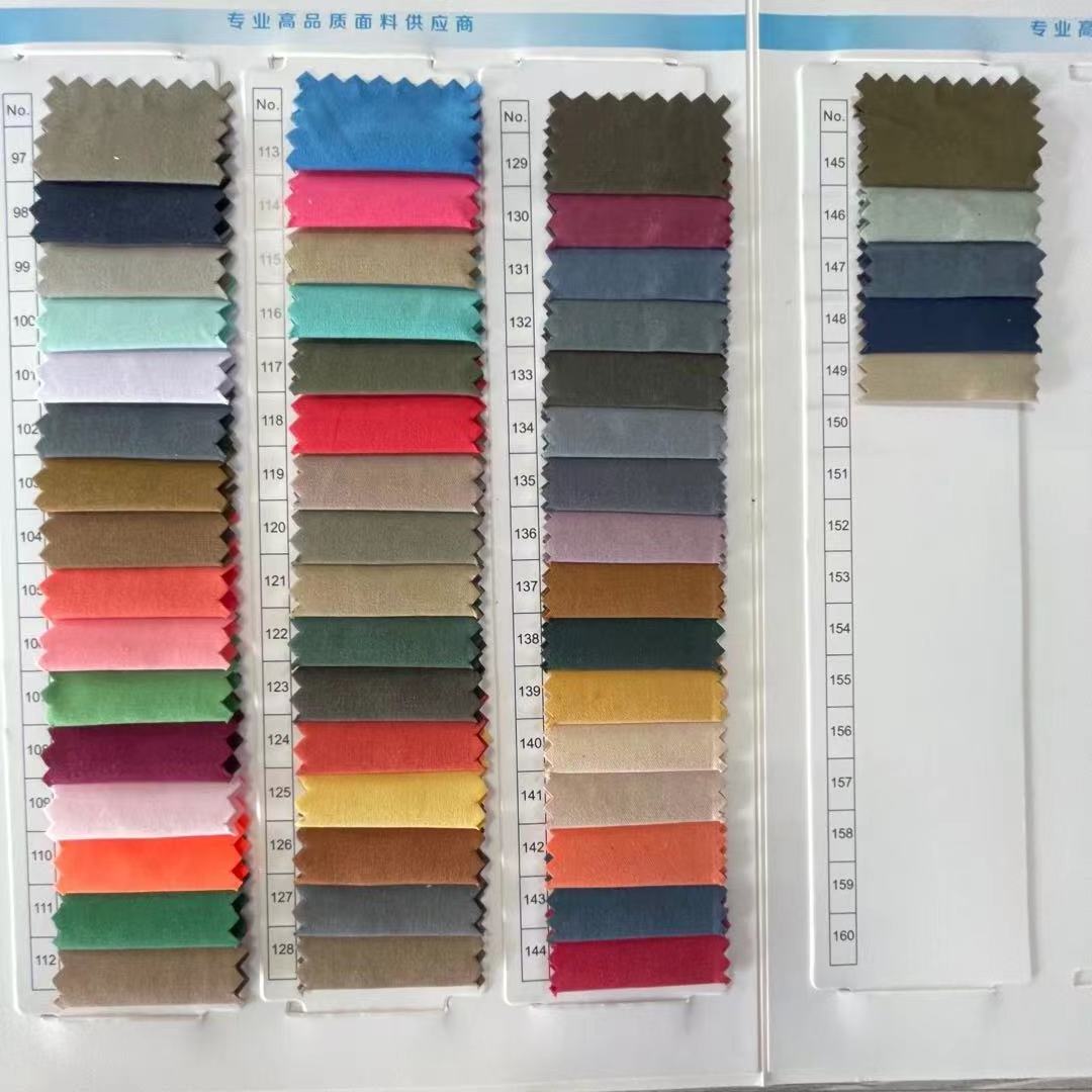 Ready goods 150 kinds of colors 15%nylon 85%polyester micro twill peach skin fabric for Jacket/downcoat