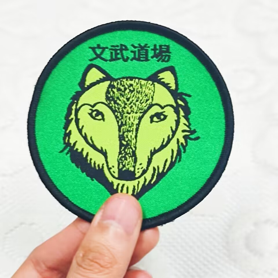 2023 Hot Sale Custom Mix Color Cool Character Design with Letter Pattern Woven Patch Round Shape Badges for Hats