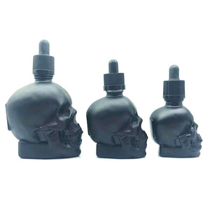 Matte black 1oz 2oz 4oz skull shaped hair oil dropper bottle tequila beard oil skull glass bottle with black childproof lid