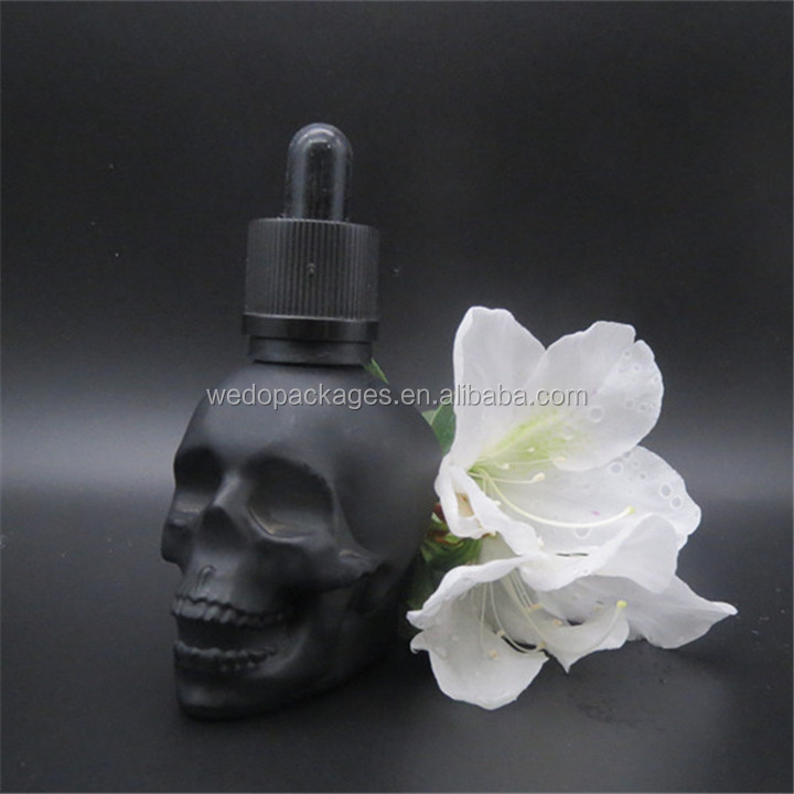 Matte black 1oz 2oz 4oz skull shaped hair oil dropper bottle tequila beard oil skull glass bottle with black childproof lid