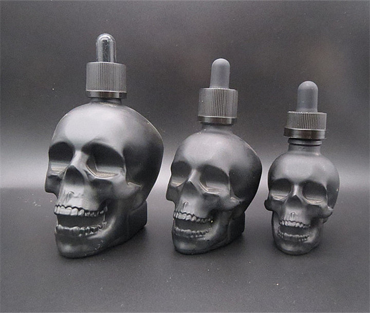 Matte black 30ml 60ml 120ml Skull Shaped Glass Perfume Bottle with Alumite/Plastic Fine Mist Spray Cap