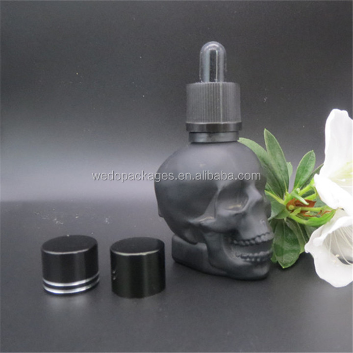 Matte black 1oz 2oz 4oz skull shaped hair oil dropper bottle tequila beard oil skull glass bottle with black childproof lid