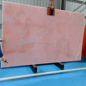 Backlit wall panels Translucent pink onyx marble slab