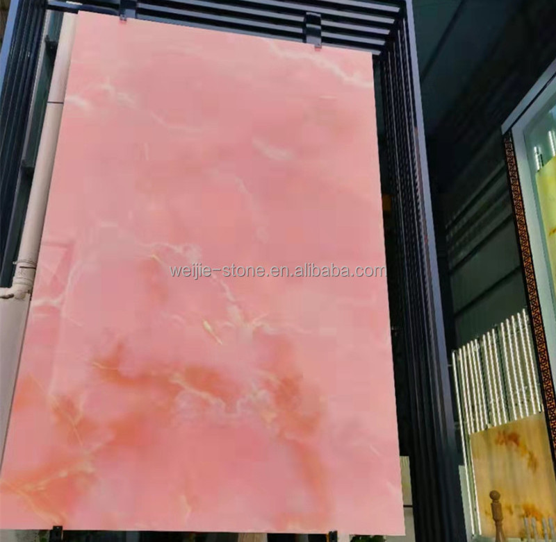 Backlit wall panels Translucent pink onyx marble slab