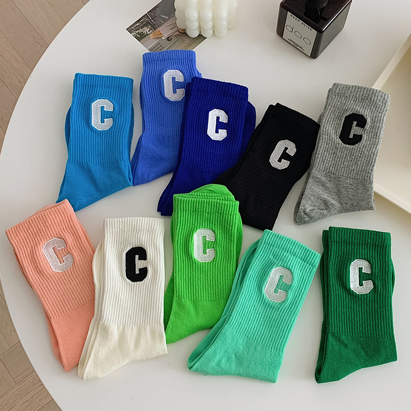 Manufacturer hot sale fashion trend letter Klein blue socks mid-calf length cotton teens socks