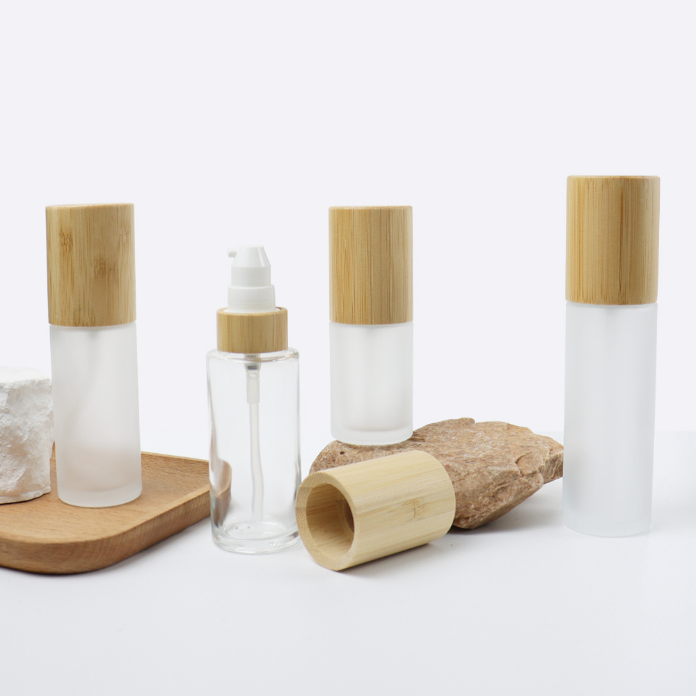 Empty bamboo cosmetic packaging 20ml 30ml 50ml 100ml 120ml frosted mist lotion pump glass oil spray bottle with wood bamboo lid