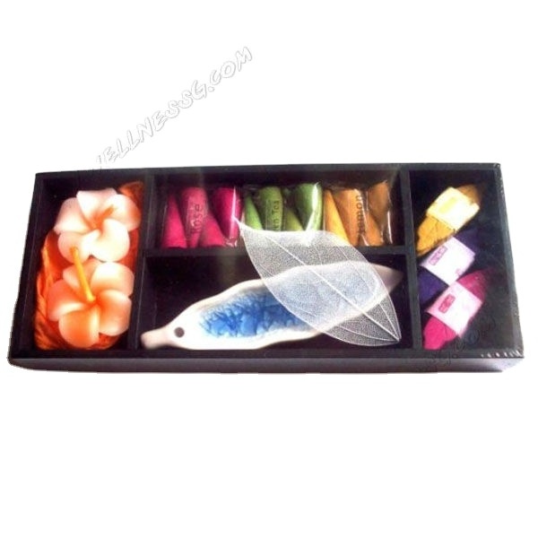 Mini scented candles and incense sticks in flower wooden holder