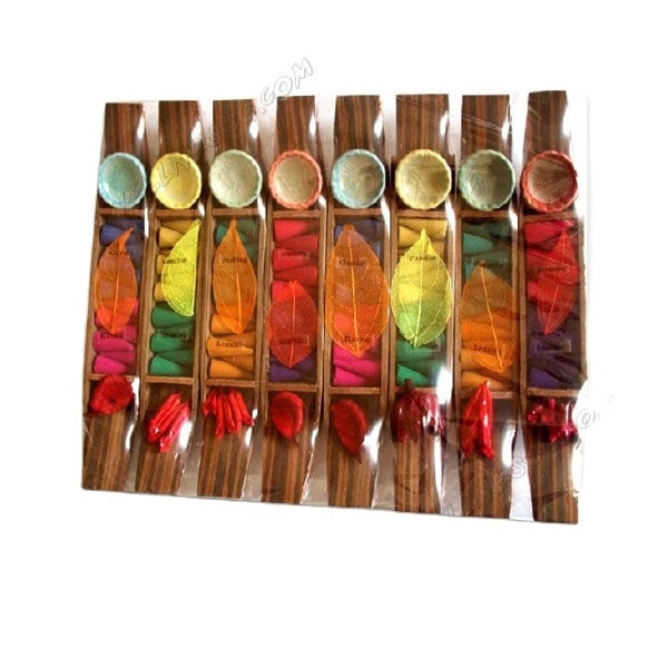 Mini scented candles and incense sticks in flower wooden holder