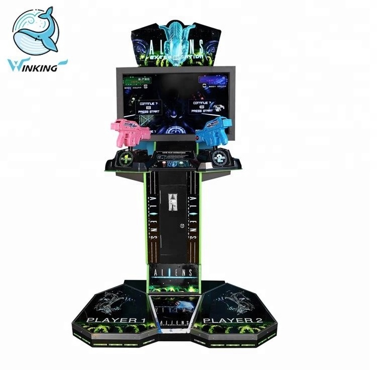 Winking Coin operated simulator arcade gun shooting Aliens extermination video game machine