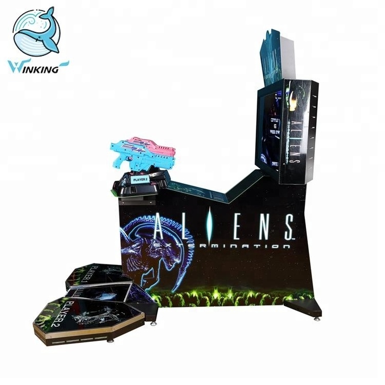 Winking Coin operated simulator arcade gun shooting Aliens extermination video game machine