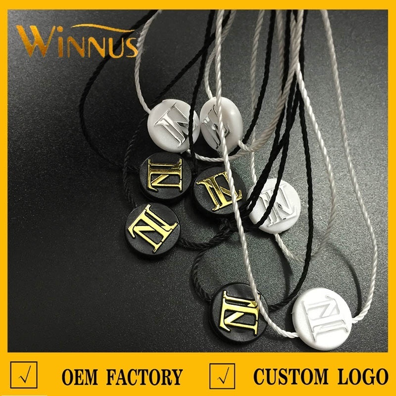 cheap custom logo name fashion design garment black round plastic ticket swing tag string hangtag loop hang tag lock