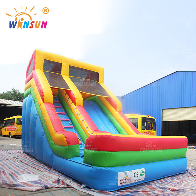 Commercial inflatable double lane slip slide large red blue slide with climbing rock outdoor slide for kids adults