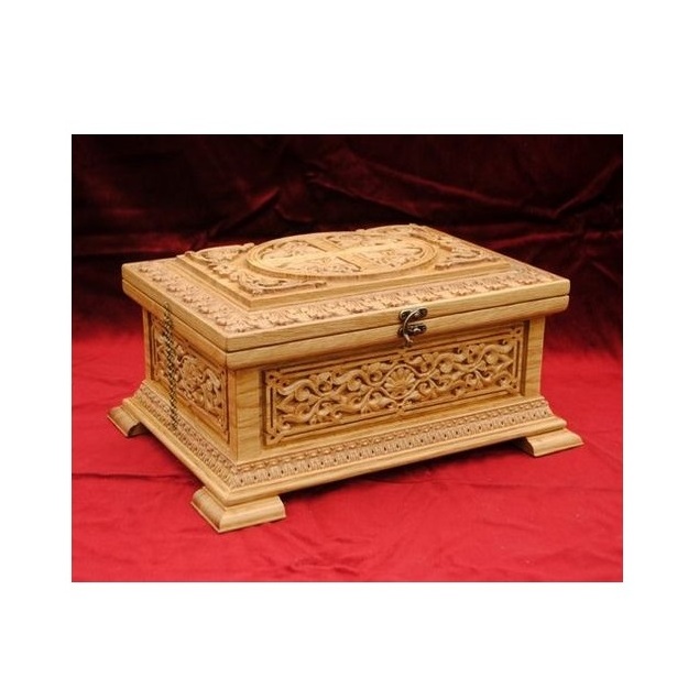 Attractive rectangular wooden trinket box decorated with a hand carved intricate floral bird design