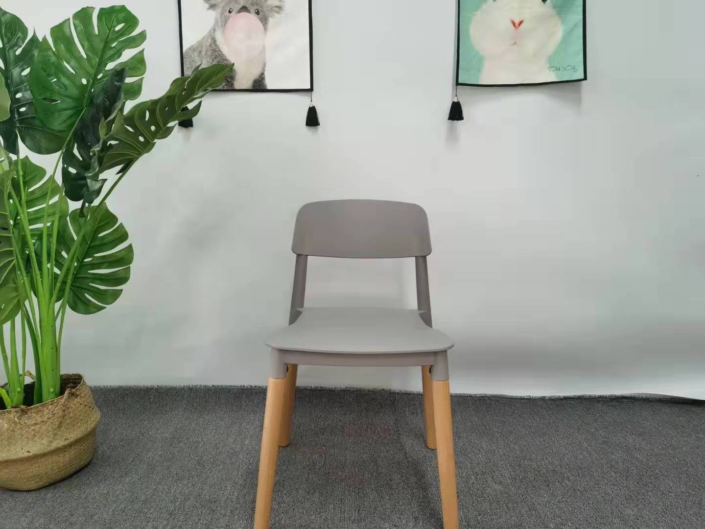 Wholesale Price Home Furniture Black PP Seat Wooden Leg Cheap Plastic Stacking Chairs for Restaurant