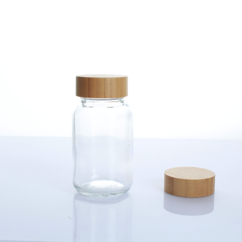 Hot Sell 150ml 200ml  bamboo top  frosted clear  cosmetic 5 oz tablet empty glass bottle with screw lid for supplement