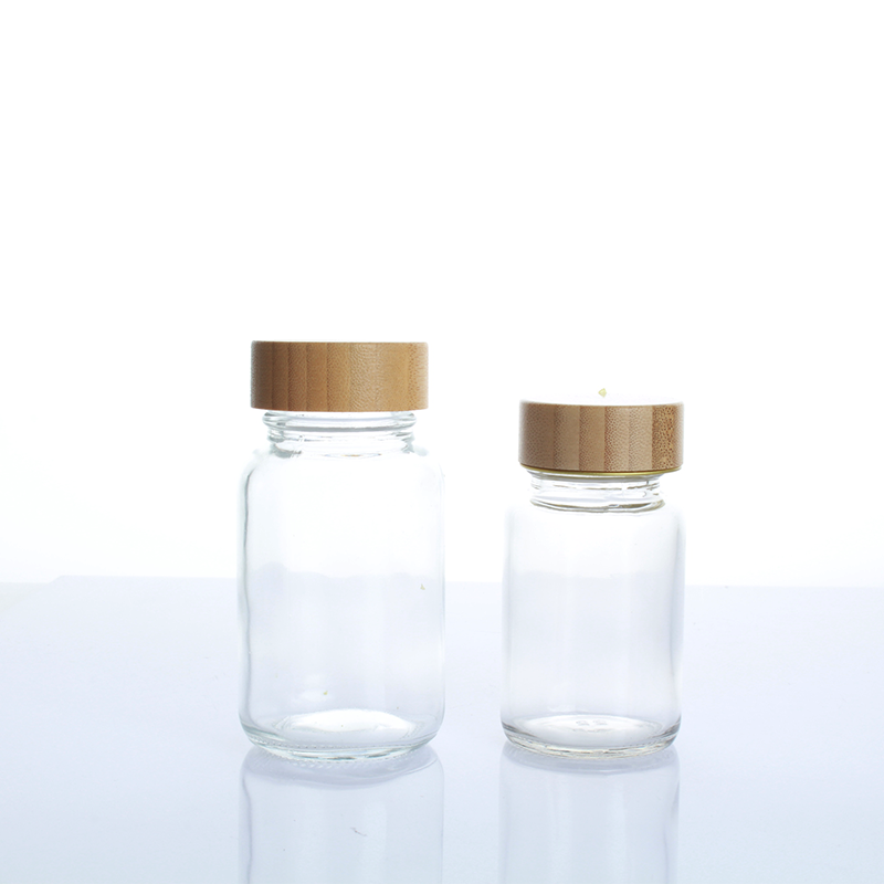 Hot Sell 150ml 200ml  bamboo top  frosted clear  cosmetic 5 oz tablet empty glass bottle with screw lid for supplement