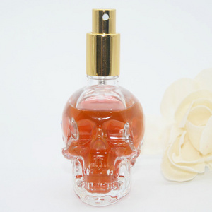 Skull shape fragrance bottle 50ml perfume glass bottle spray