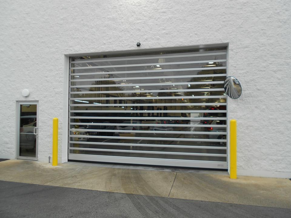 Jianda Hot Sale Hard Fast Material Commercial Industrial PVC Warehouse Dock Door Aluminum Roll Up Rapid High Speed Spiral Door