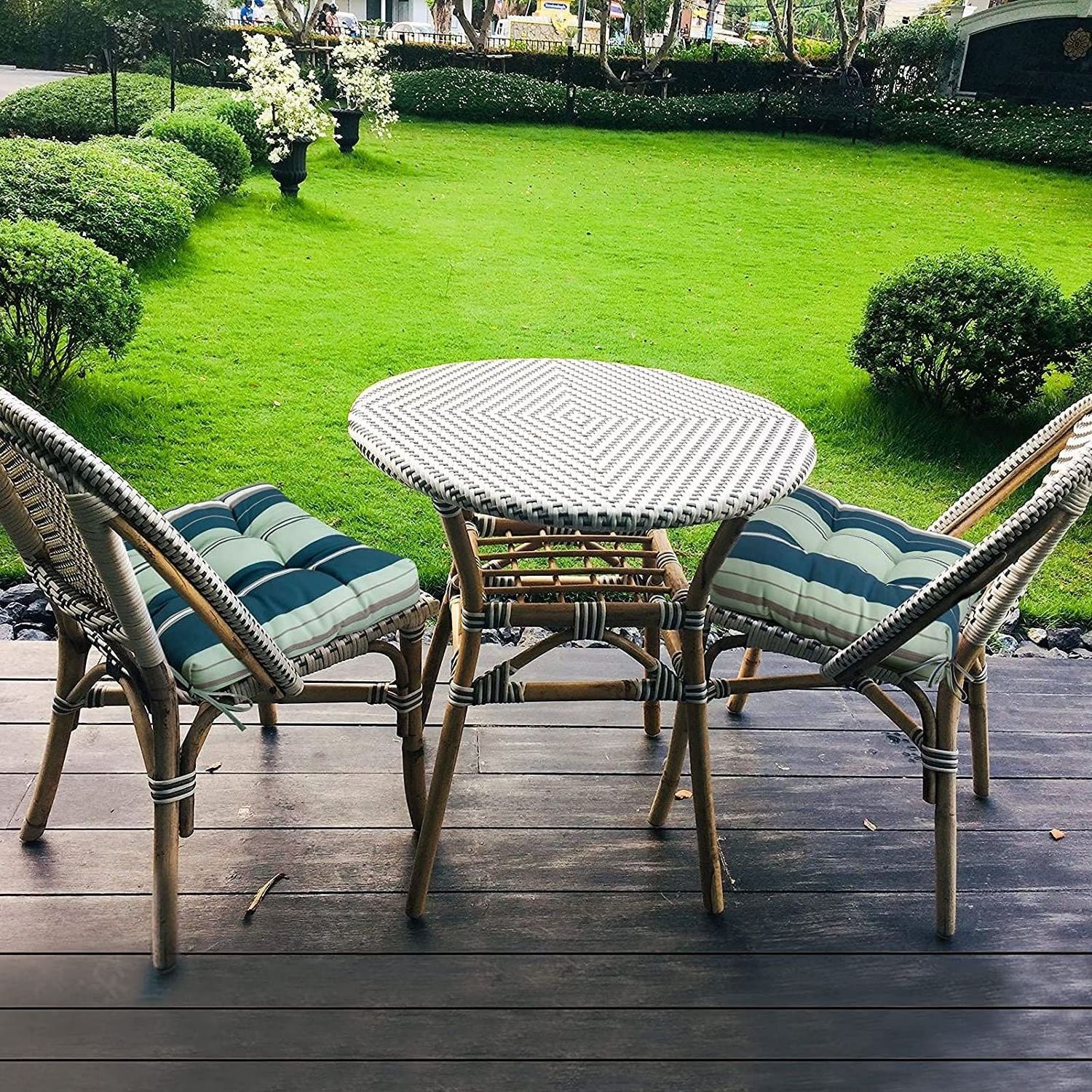 Outdoor French rattan glass table and chairs outside patio garden french bistro restaurant table set